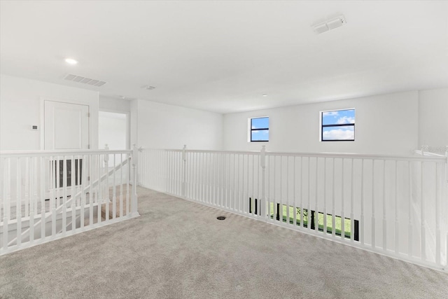 empty room with light colored carpet