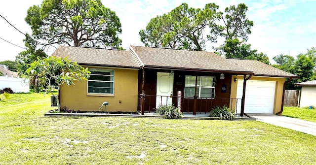 ranch-style home featuring a garage and a front yard