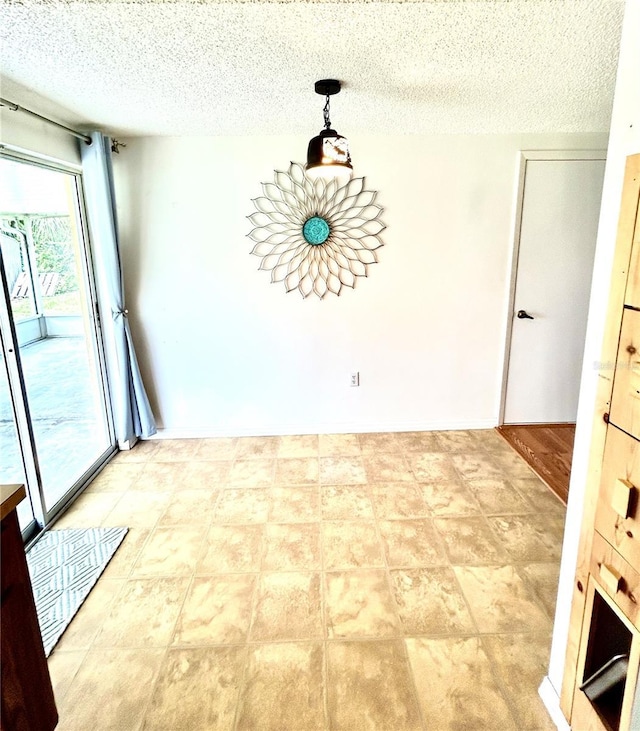 empty room with a textured ceiling