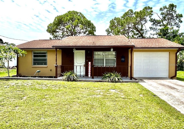 ranch-style house featuring an attached garage, a front yard, concrete driveway, and stucco siding