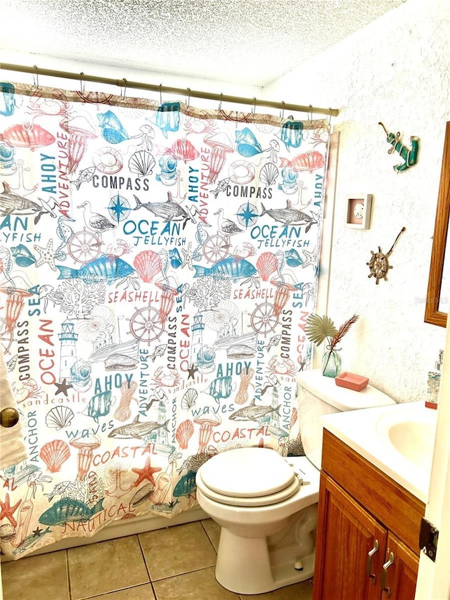 full bath featuring tile patterned flooring, a textured ceiling, toilet, and vanity