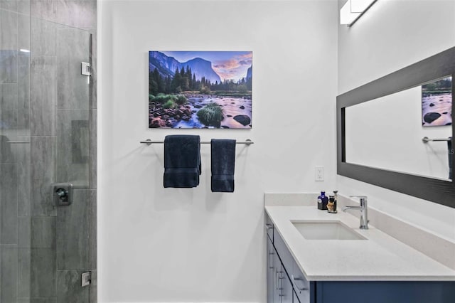 bathroom featuring vanity and a tile shower