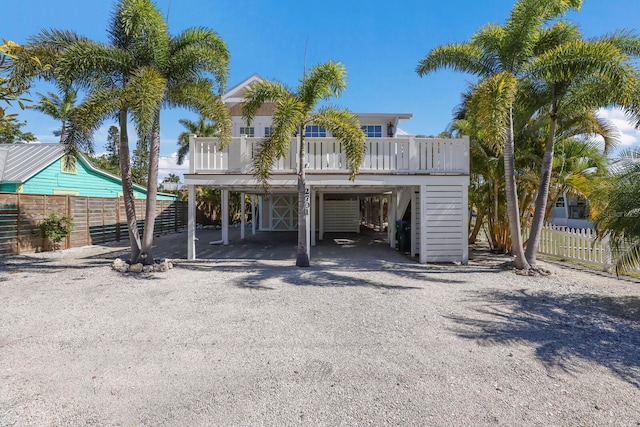 coastal inspired home featuring a carport