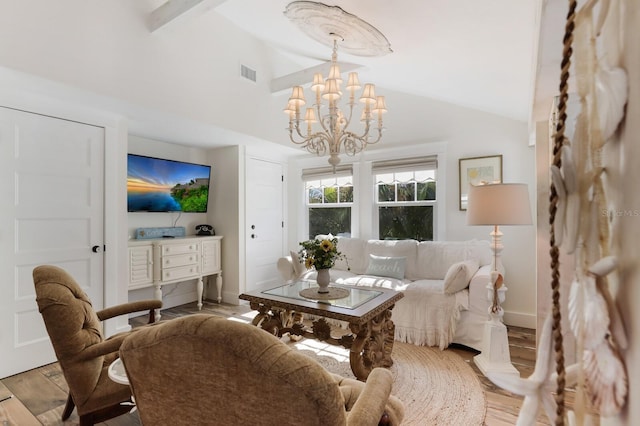 living room featuring lofted ceiling with beams, light hardwood / wood-style floors, and an inviting chandelier