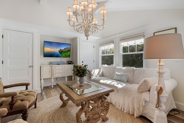 living room with hardwood / wood-style floors and a chandelier