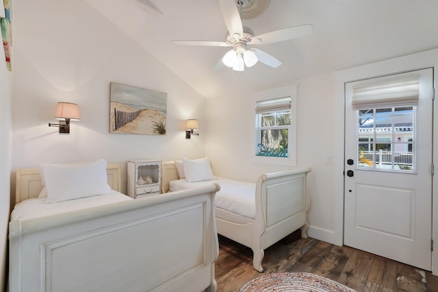 bedroom with ceiling fan, dark hardwood / wood-style flooring, and lofted ceiling