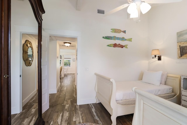 bedroom with dark hardwood / wood-style floors and ceiling fan