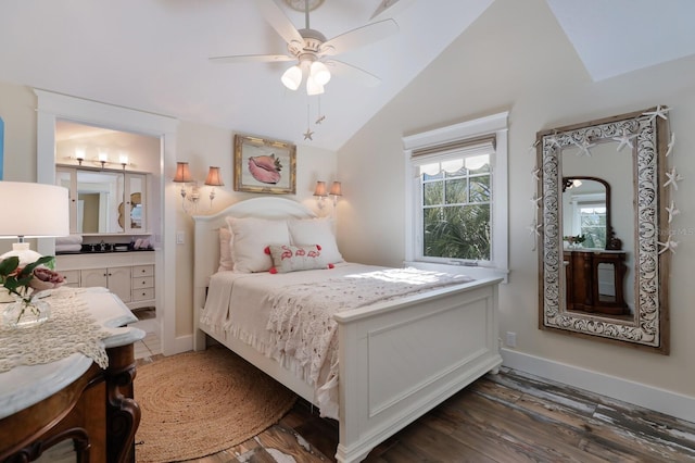 bedroom featuring connected bathroom, dark hardwood / wood-style floors, vaulted ceiling, and ceiling fan