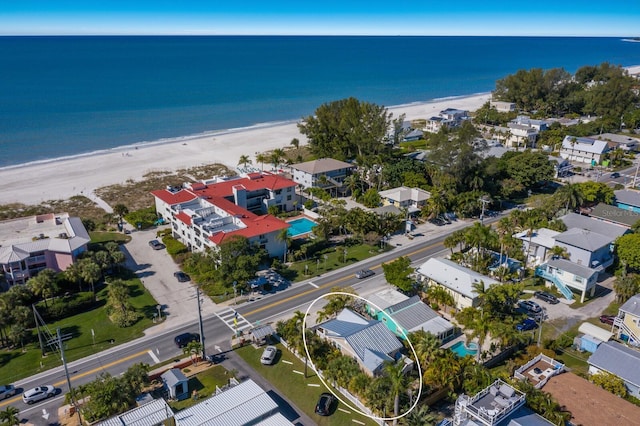 bird's eye view featuring a view of the beach and a water view