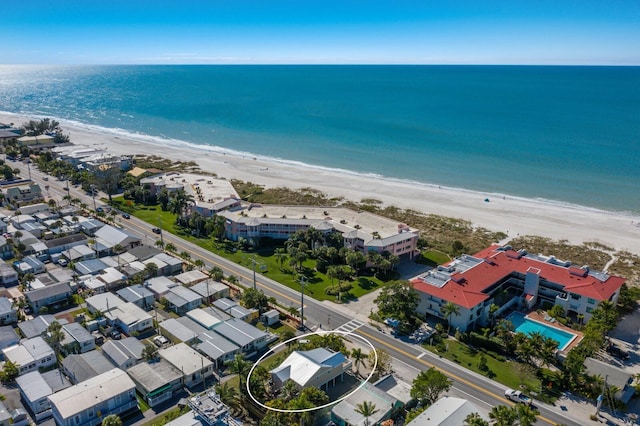 bird's eye view featuring a water view and a view of the beach