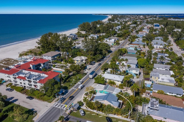 drone / aerial view with a water view and a view of the beach