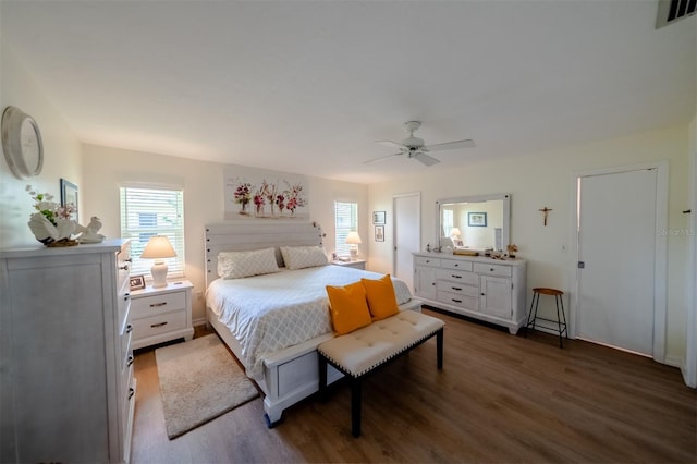 bedroom with ceiling fan and dark wood-type flooring