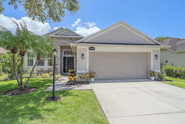 view of front facade featuring a front yard and a garage