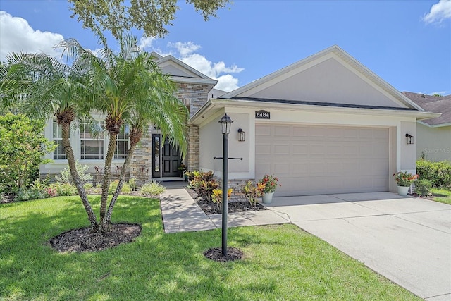 view of front facade with a front lawn and a garage