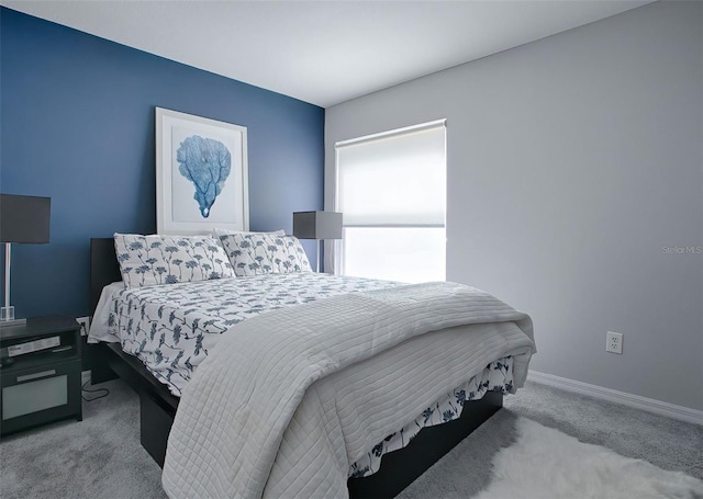 bedroom with light colored carpet