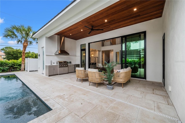 view of patio / terrace featuring ceiling fan, area for grilling, and sink