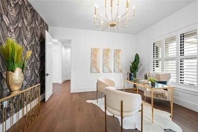 living area featuring a chandelier and dark hardwood / wood-style floors