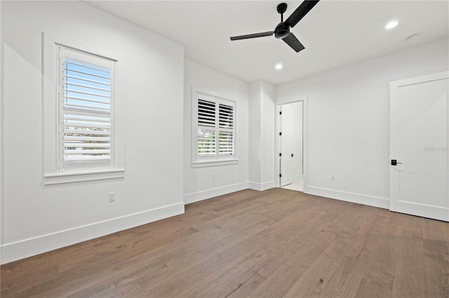 spare room with ceiling fan and light hardwood / wood-style floors