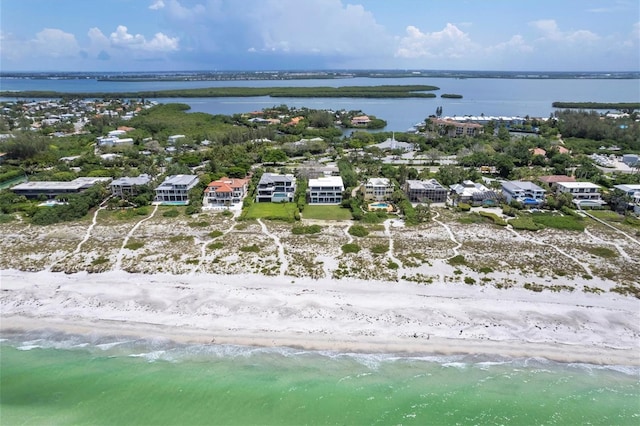 aerial view with a water view and a view of the beach