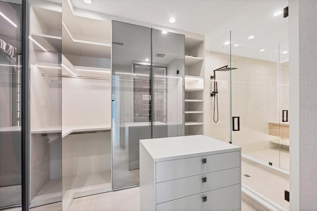 walk in closet featuring light tile patterned floors