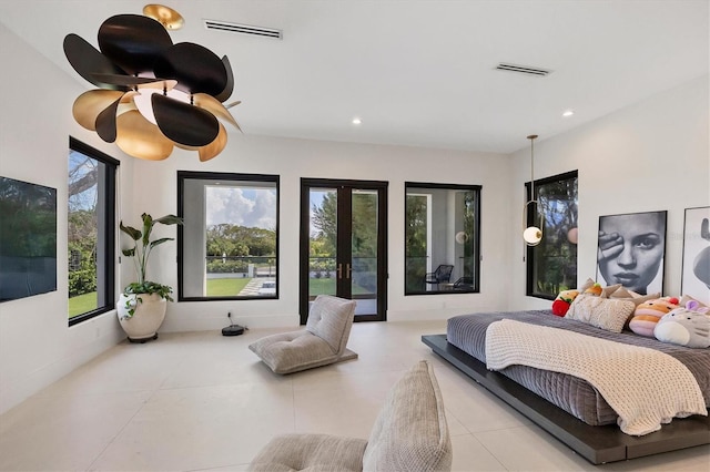 bedroom with multiple windows and french doors