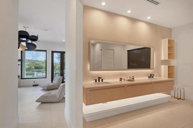 bathroom featuring tile patterned flooring and vanity