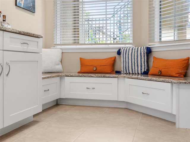 living area featuring light tile patterned floors