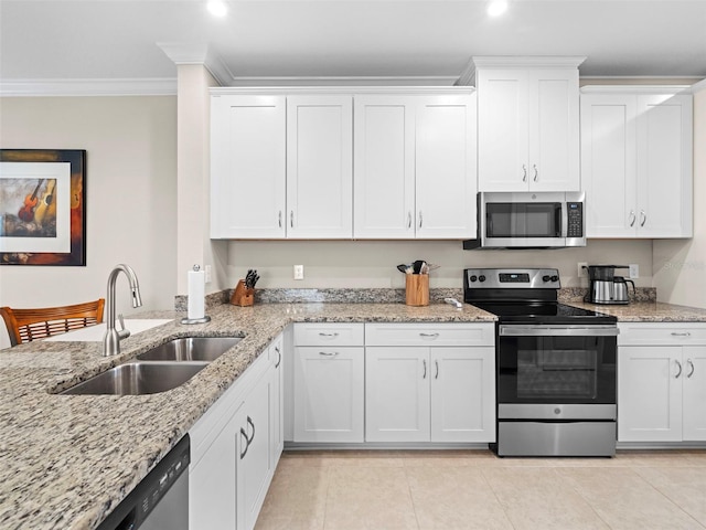 kitchen featuring white cabinetry, appliances with stainless steel finishes, sink, and crown molding