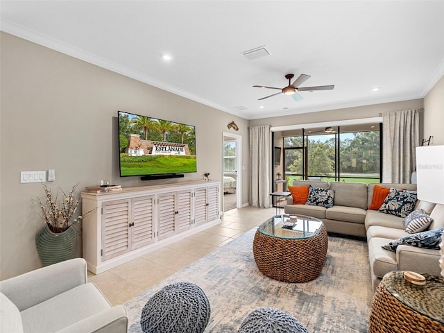 living room with ornamental molding, light tile patterned floors, and ceiling fan