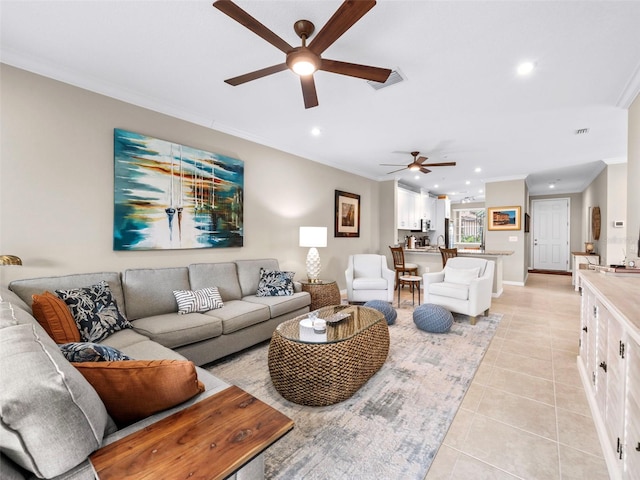 living room featuring ornamental molding, ceiling fan, and light tile patterned flooring