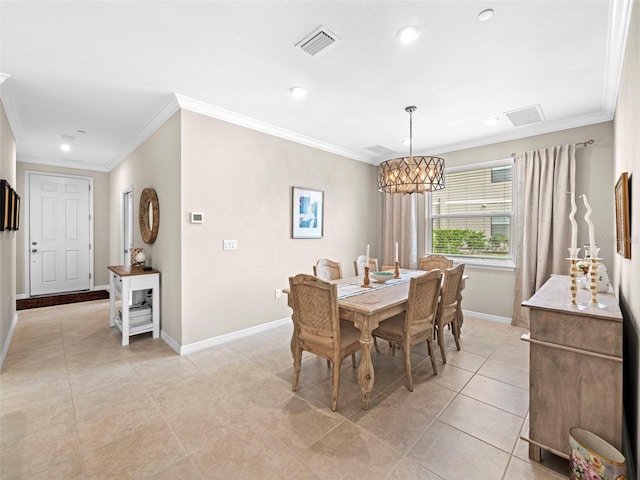 dining area with ornamental molding, light tile patterned floors, and a notable chandelier