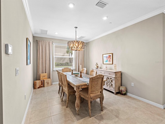 dining area featuring a notable chandelier, crown molding, and light tile patterned flooring