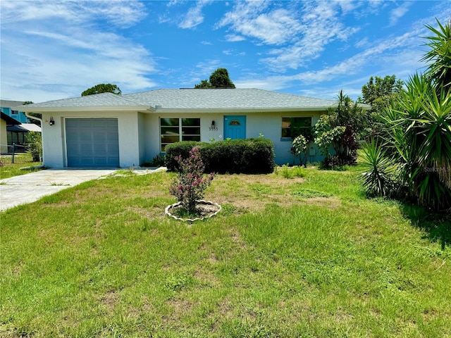 single story home with a garage and a front yard