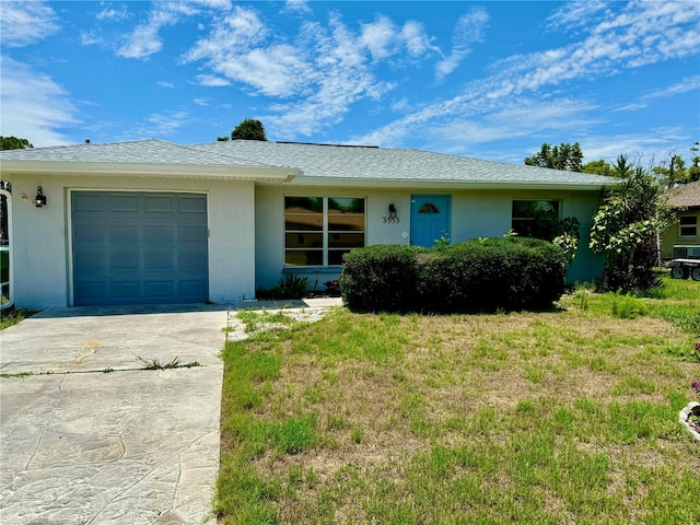 ranch-style home featuring a garage