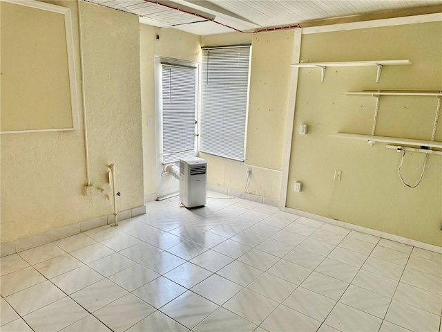 unfurnished room featuring light tile patterned flooring