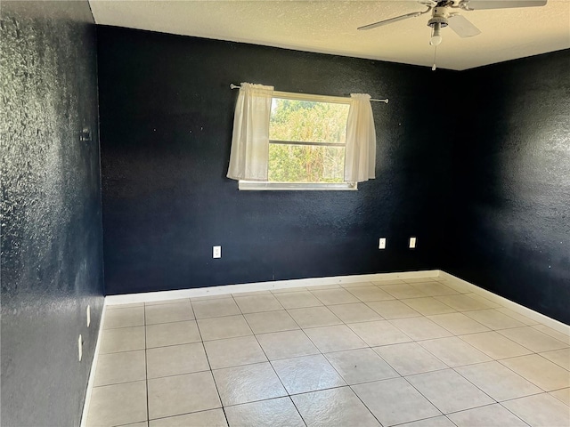 tiled empty room with ceiling fan