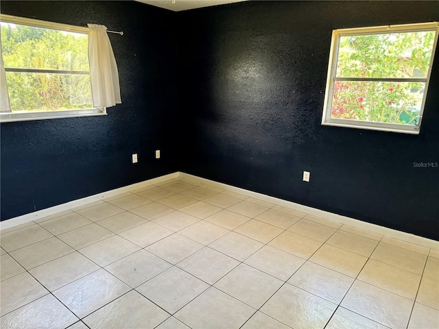 view of tiled spare room