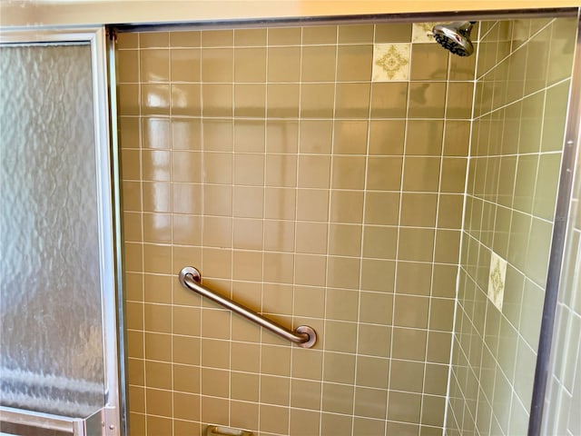 bathroom with tiled shower