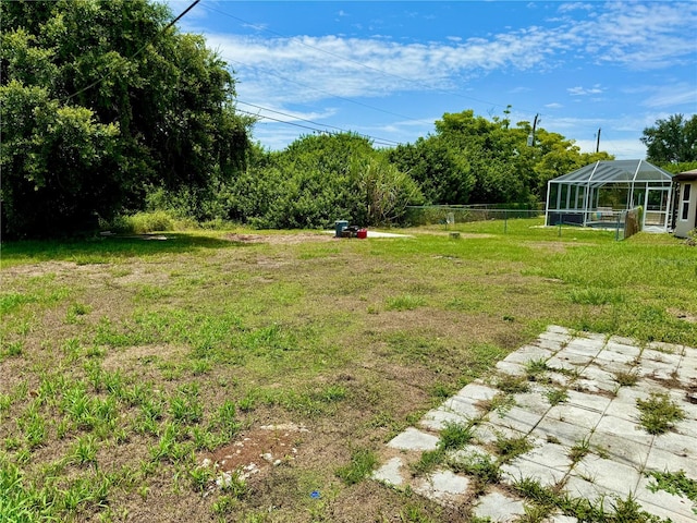 view of yard with a lanai