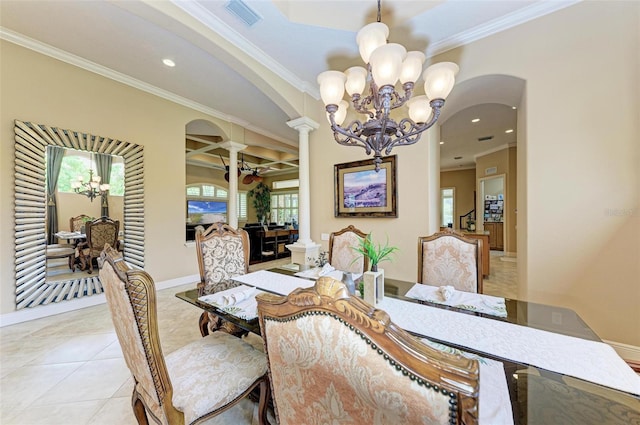 tiled dining space with an inviting chandelier, ornate columns, and ornamental molding