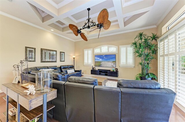 living room with beamed ceiling, a wealth of natural light, coffered ceiling, and hardwood / wood-style flooring