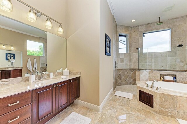 bathroom featuring tile patterned flooring, plus walk in shower, vanity, and plenty of natural light