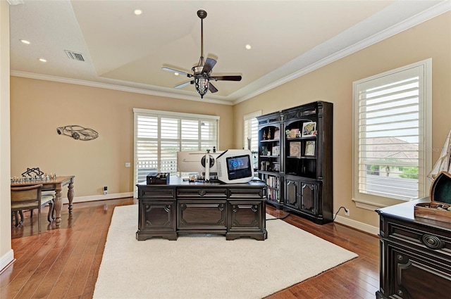 office with dark wood-type flooring, ornamental molding, and ceiling fan