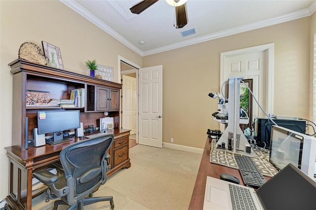 home office featuring ceiling fan, ornamental molding, and light colored carpet