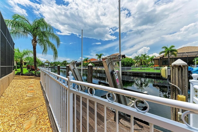 dock area featuring a water view and a lanai