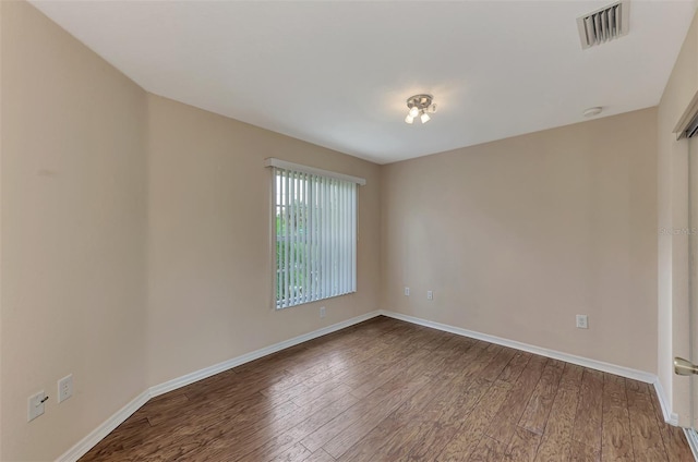 empty room featuring hardwood / wood-style flooring