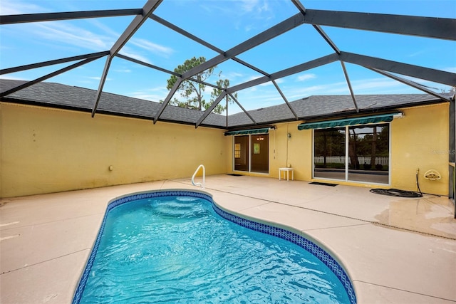 view of pool featuring a lanai and a patio