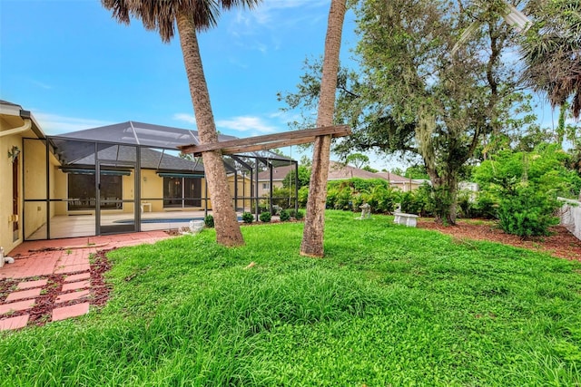 view of yard with a lanai and a patio