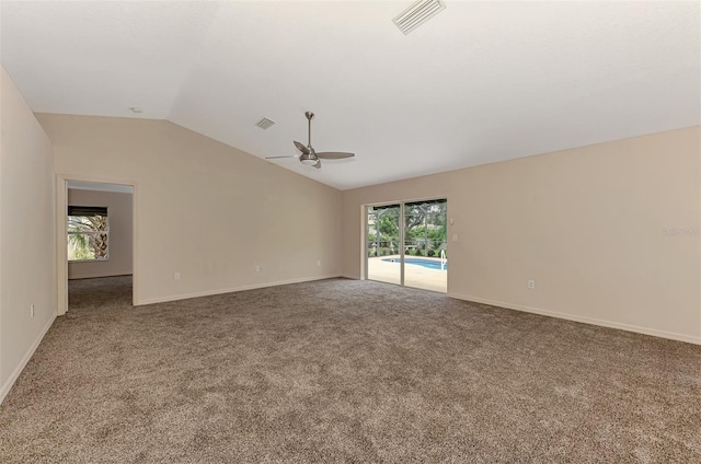 spare room with ceiling fan, carpet, and lofted ceiling