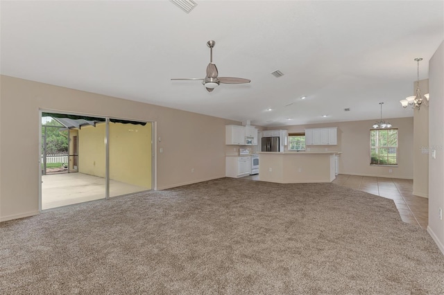 unfurnished living room with light carpet and ceiling fan with notable chandelier